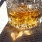 a glass of whiskey on a book
